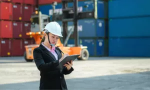 Customs broker reviewing customs documents during international shipping