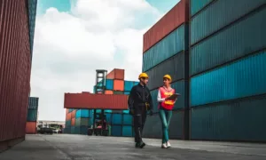 Customs team checking shipment paperwork for cross-border road transport